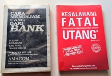 Buku Merah Vs Buku Hitam